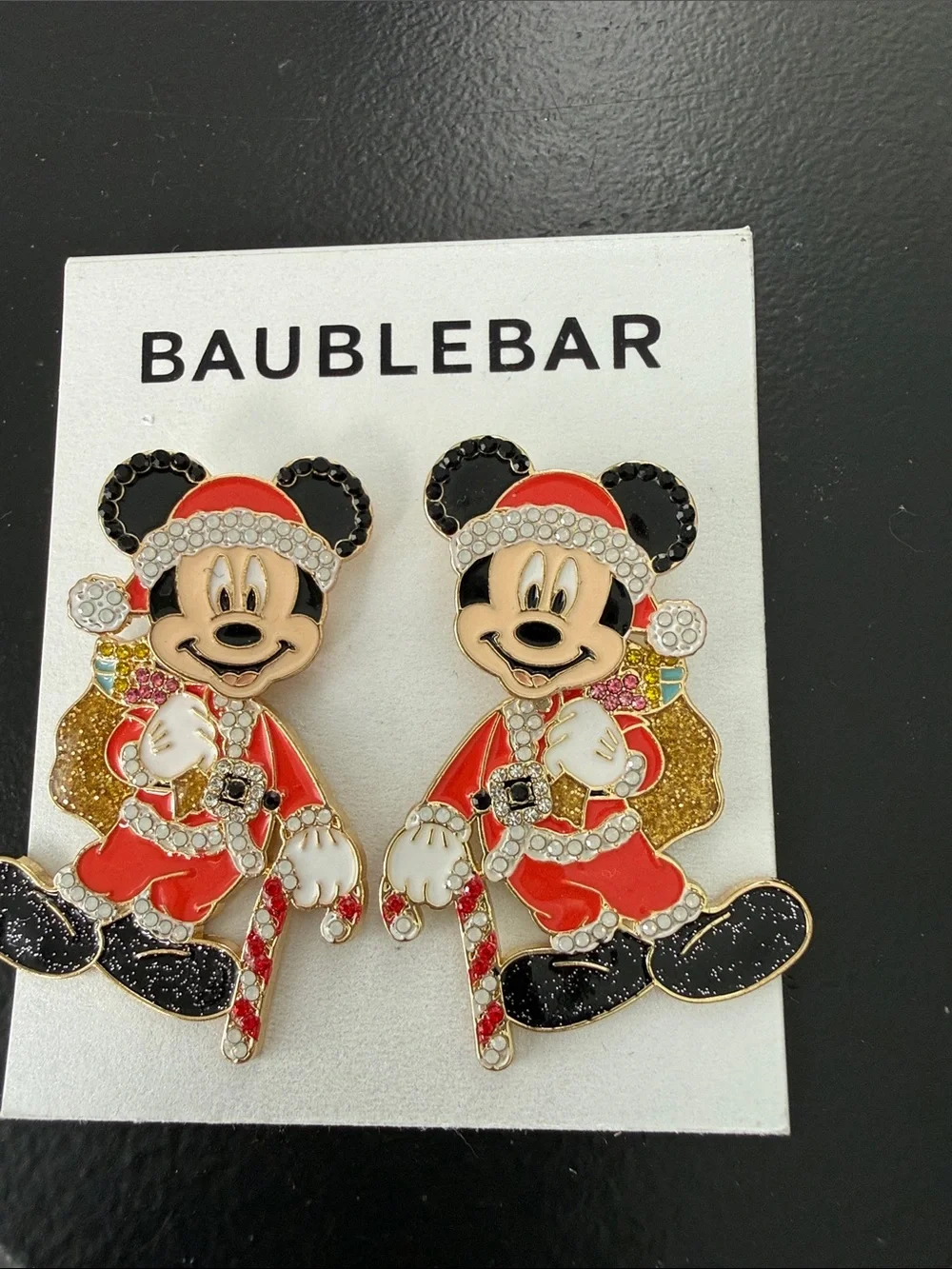 NEW BaubleBar Disney holiday earrings feature a sparkling Santa Mickey Mouse
